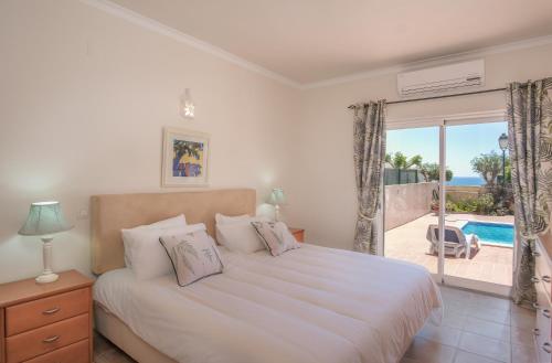 En eller flere senge i et værelse på Villa Acacias 18, Brisa do Mar