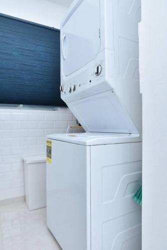a kitchen with a white refrigerator and a stove at Apto Juan Dolio Tepuy 601 F in Juan Pedro