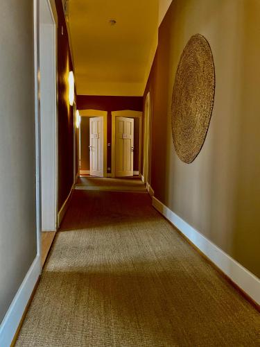 an empty hallway with red walls and a yellow ceiling at AUERSTEIN-Hotels auerstein & auerstein-mono in Heidelberg