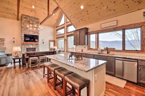 a kitchen with a large island and a living room at Mountainside Retreat with Fire Pit in Banner Elk in Valle Crucis