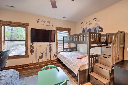 a bedroom with a bunk bed and a tv at Mountainside Retreat with Fire Pit in Banner Elk in Valle Crucis