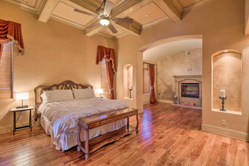 a bedroom with a bed and a fireplace at Stunning Palmdale Villa Oasis on Vineyard! in Palmdale