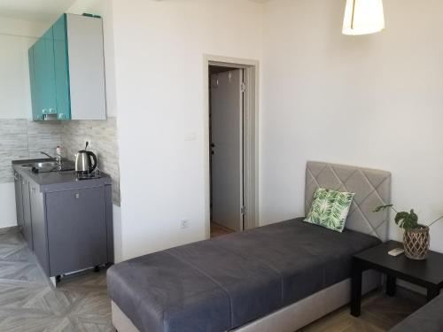 a bedroom with a bed and a sink and a mirror at Aparthotel Monterria in Bar