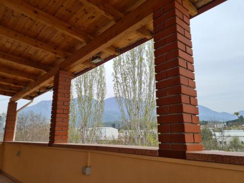 a view from the balcony of a house at Bar Kafe Pjetri Guest House in Patza-Kuqani