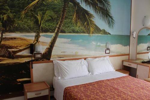 Postel nebo postele na pokoji v ubytování Hotel Apis