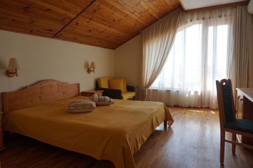 Ένα ή περισσότερα κρεβάτια σε δωμάτιο στο Margarita Hotel