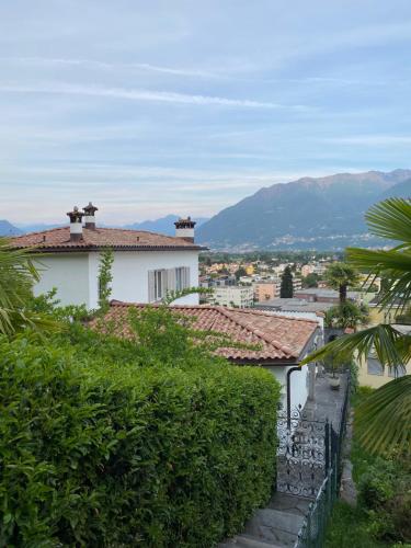 a view of a city with mountains in the background at Villa Incanto in Ascona