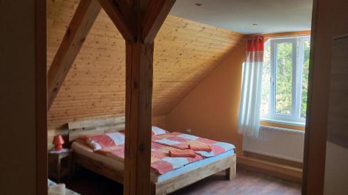 Postel nebo postele na pokoji v ubytování Penzion u Pilaře