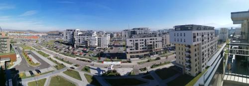 an aerial view of a city with tall buildings at Luxury panorama apartament,Coresi in Braşov