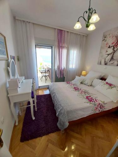 a bedroom with a white bed and a piano at Villa Domic in Slatine