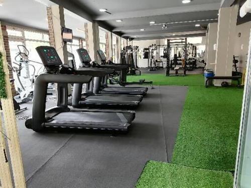 a row of tread machines in a gym at CentrRooms-DS in Struga