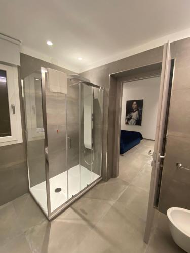 a bathroom with a shower and a toilet and a sink at IL DUCA HOUSE e HOLIDAY PRESTIGE in Caccamo