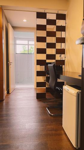 an office with a desk and a chair next to a door at Verde Vale Hotel in Videira