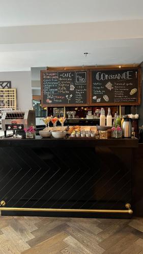a bakery with a counter with food on it at The Wild Oscar in Mexico City