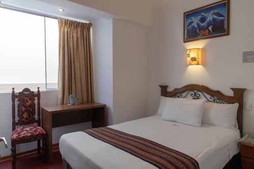 Postel nebo postele na pokoji v ubytování Hotel Rojas Inn