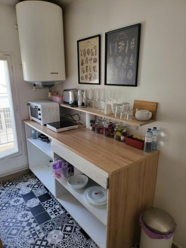 a kitchen with a counter with food on it at Appartement zen et calme, centre ville in Vendôme