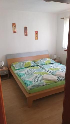 Postel nebo postele na pokoji v ubytování Apartmány u Pilaře