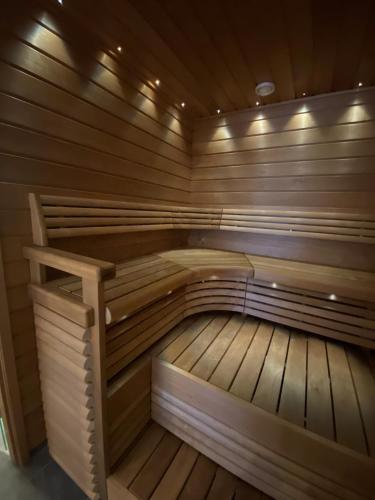 a large wooden sauna with a wooden floor at Björkö SeaLodge in Björkö