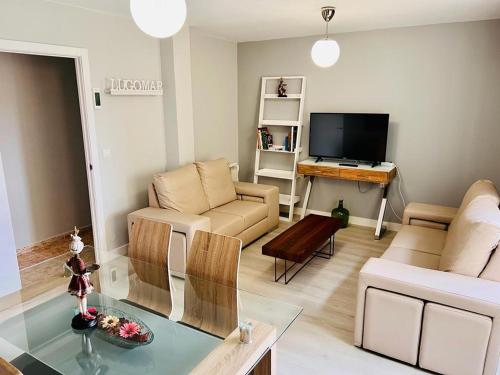 a living room with a couch and a table at Viveiro-Lugomar in Viveiro