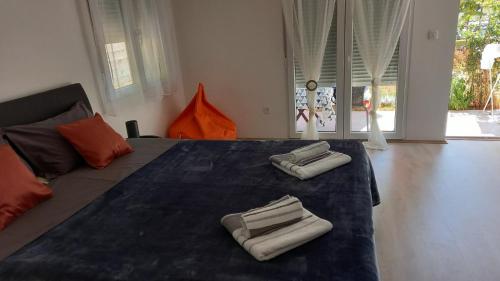 Posteľ alebo postele v izbe v ubytovaní Leona apartment Vidikovac, Pula