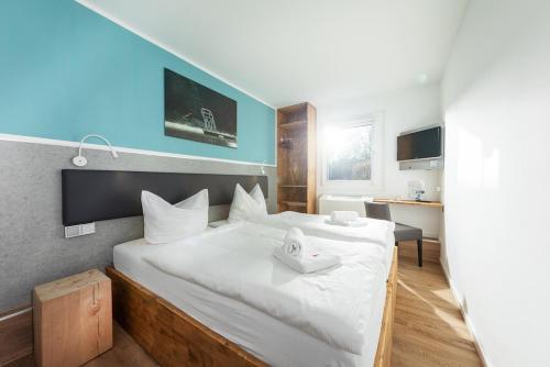 Cama ou camas em um quarto em T3 Budget Zwickau