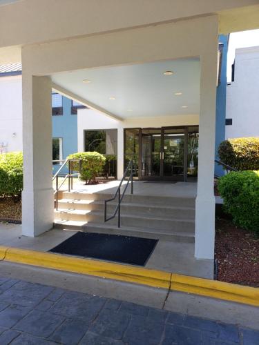 a lobby of a building with stairs and windows at Quality Inn & Suites Clemmons I-40 in Clemmons