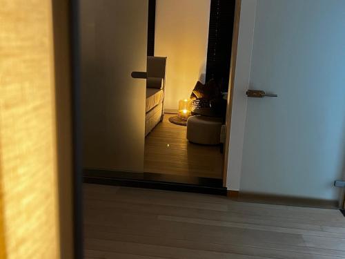 a view of a living room with a candle in a mirror at Maison Gand in Ghent