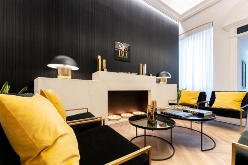 a living room with a couch and a fireplace at Nero Luxury Suites in Cagliari