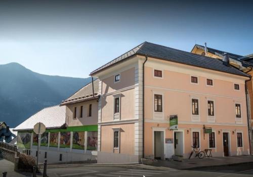 a large building on the side of a street at Apartma Bovec Center in Bovec