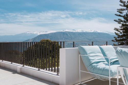 a balcony with a view of snow covered mountains at Hermes&Dione in Argoulidhés