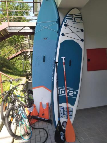 two surfboards are leaned up against a wall at Apartmán 10 in Županovice