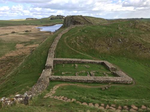 an aerial view of a ruin in a field at Belford House Self Check-in Rooms in Haltwhistle