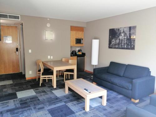 a living room with a couch and a table at Holiday Inn Express Mexico Reforma by IHG in Mexico City