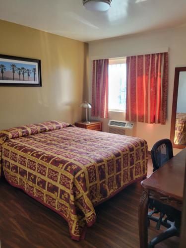 Lido Hotel tesisinde bir odada yatak veya yataklar