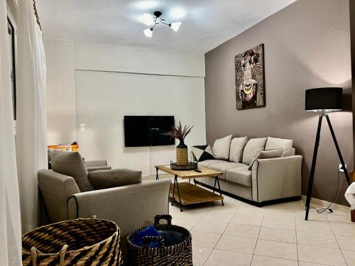 Televisyen dan/atau pusat hiburan di IONIAN SUITES by Bruskos