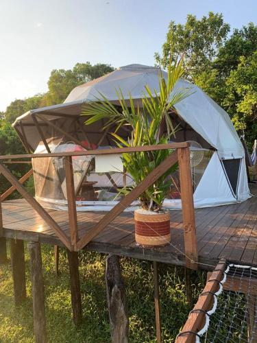 a tent sitting on top of a wooden deck at Eco-Glamping Shalom in Mariquita