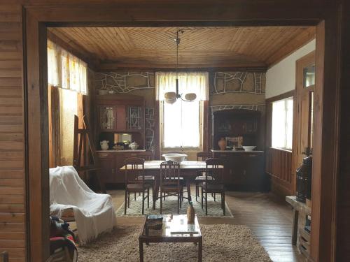 a dining room with a table and chairs in it at Casa da Vila in Penamacor