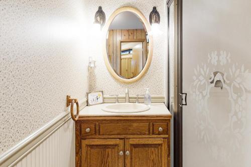a bathroom with a sink and a mirror at The Treehouse in Joseph