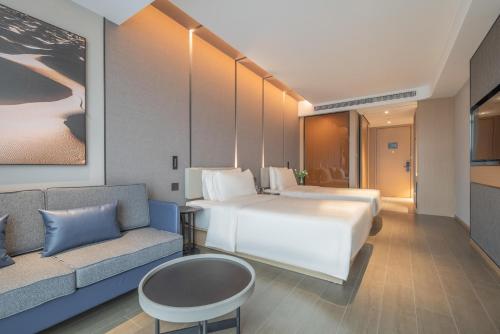 Ένα ή περισσότερα κρεβάτια σε δωμάτιο στο Atour Hotel Nanjing Jiangbei New District University of Technology