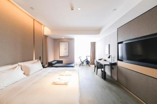 Μια τηλεόραση ή/και κέντρο ψυχαγωγίας στο Atour Hotel Luoyang Yingtianmen
