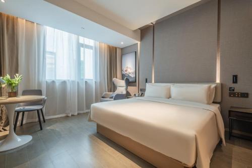 Ένα ή περισσότερα κρεβάτια σε δωμάτιο στο Atour Hotel Nanjing Jiangbei New District University of Technology