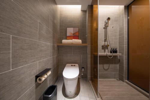 a bathroom with a toilet and a shower at Atour Hotel Nanjing NUAA Ming Palace in Nanjing