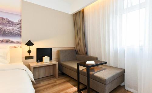 Ένα ή περισσότερα κρεβάτια σε δωμάτιο στο Atour Hotel Qinghuangdao Shanhaiguang