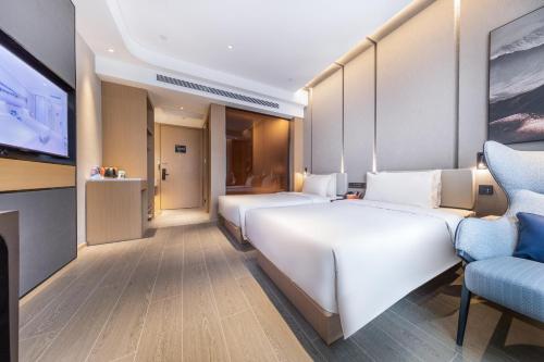 Μια τηλεόραση ή/και κέντρο ψυχαγωγίας στο Atour Hotel Taiyuan Changfeng Business Center Wanxiang City