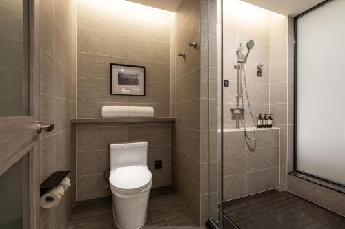 a bathroom with a toilet and a shower at Atour Hotel Xian Xianyang International Airport in Xi'an