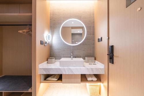 Ванная комната в Atour Hotel Lingang New Town
