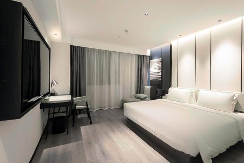 Katil atau katil-katil dalam bilik di Atour Hotel Wuhan Optics Valley Square Yangjia Bay