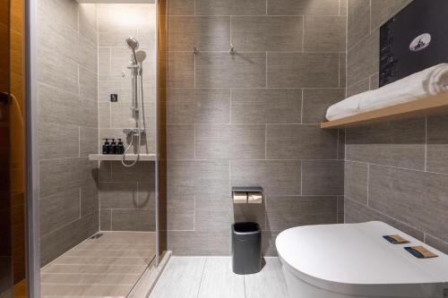 a bathroom with a toilet and a shower at Atour Hotel Nanjing NUAA Ming Palace in Nanjing