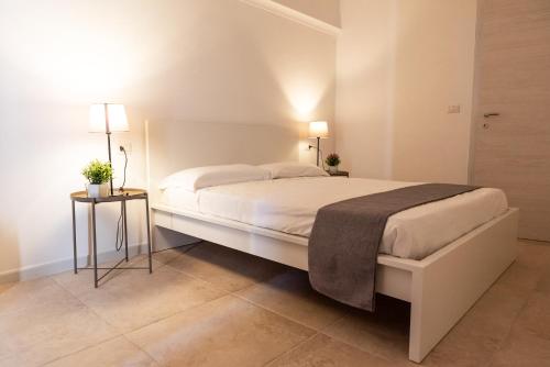 Postel nebo postele na pokoji v ubytování Le Dimore di Mariuccia Relax & SPA