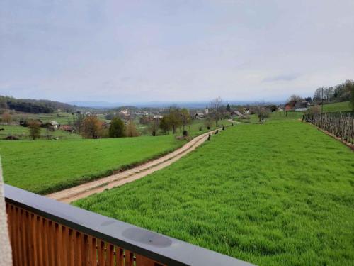 a view of a green field from a balcony at Holiday home in Semic Kranjska Krain 42896 in Semič